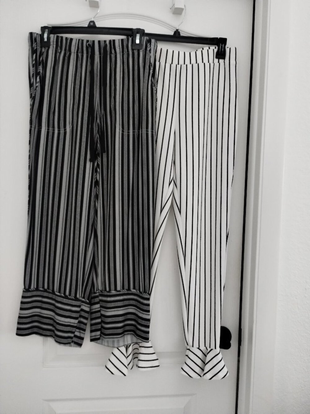 2 pair of black and white pants
